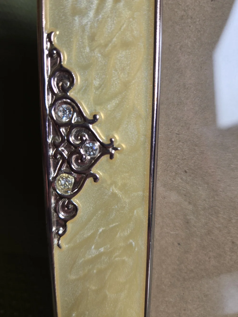 Elegant Yellow Gold Faux Marble Design with Silver Accent Scrolls Phone Frame